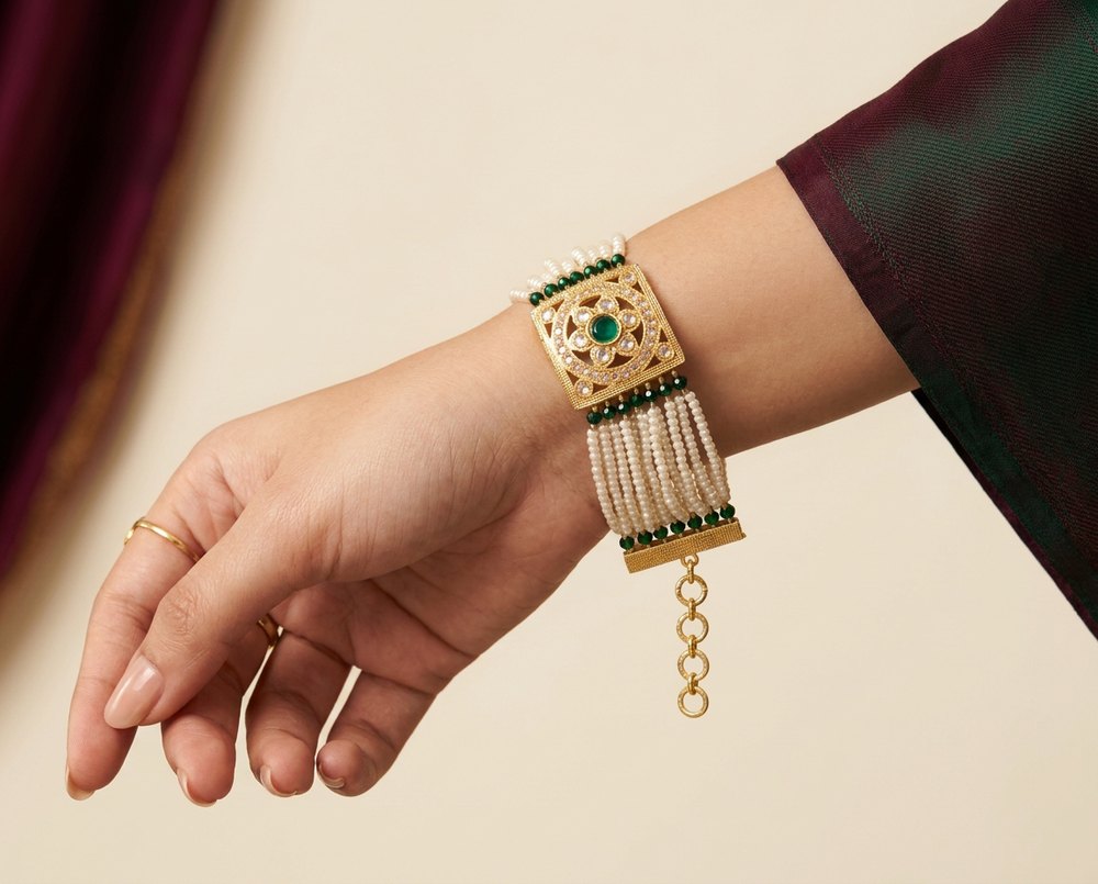 Model wearing the Moti seed pearl and emerald bead bracelet