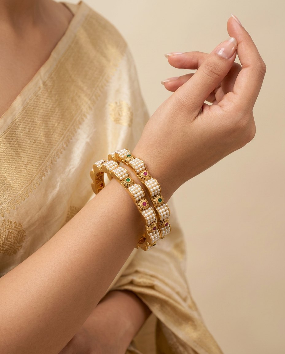 Model wearing the Motiya Kada pearl-set gold bangles