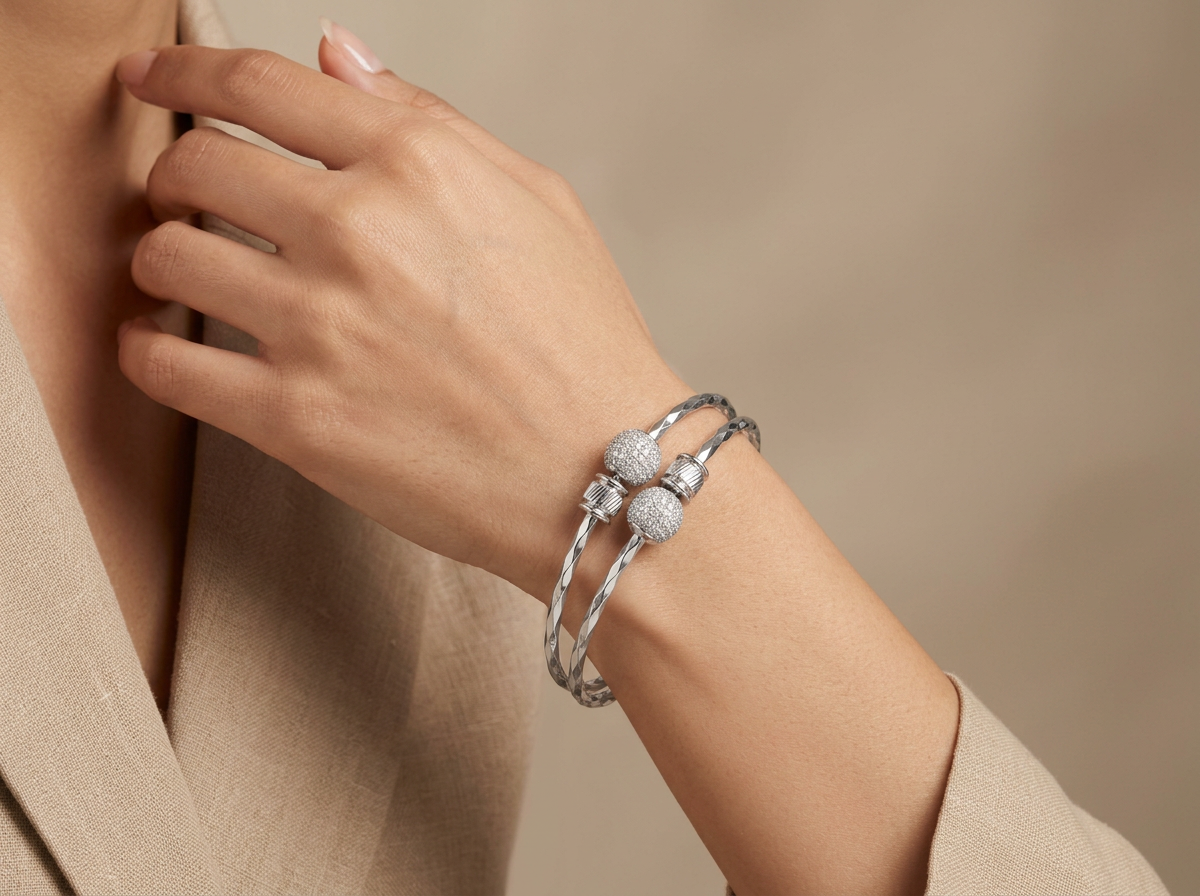 Model wearing the Rupa silver-tone hammered bangles with pavé ball tips